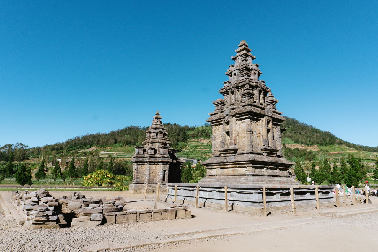 Mastering the First Impression: Your intriguing post title goes here Historic Hindu temple in lush landscape under a vivid blue sky, perfect for cultural and travel themes.