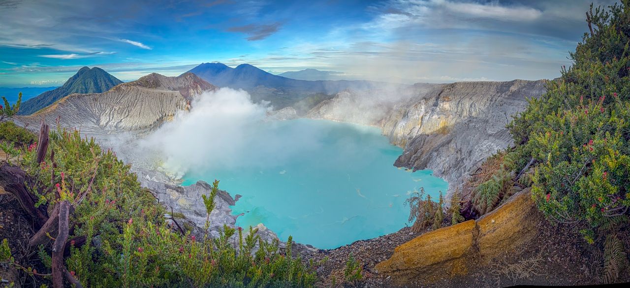 Services Breathtaking view of Ijen Crater's turquoise lake surrounded by volcanic landscape in East Java, Indonesia.